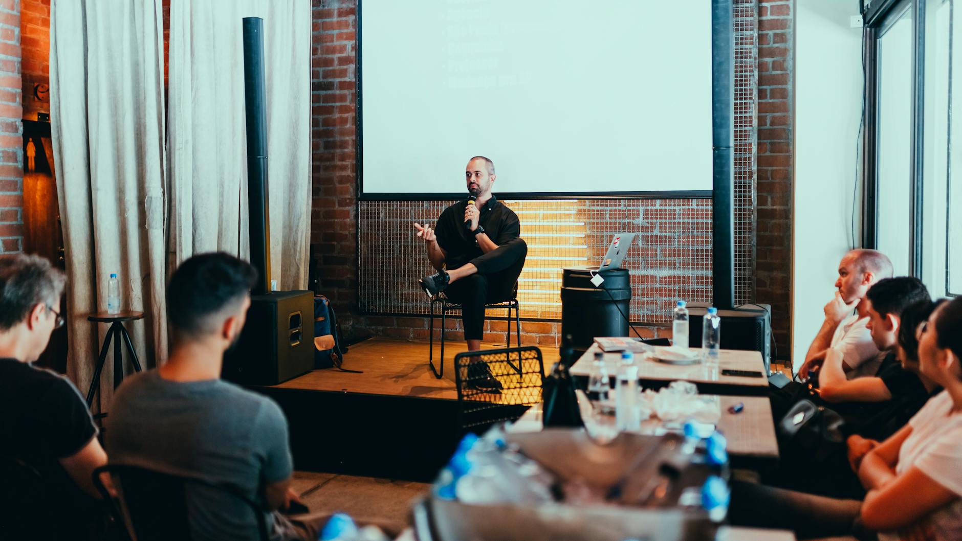 photo of man holding mic