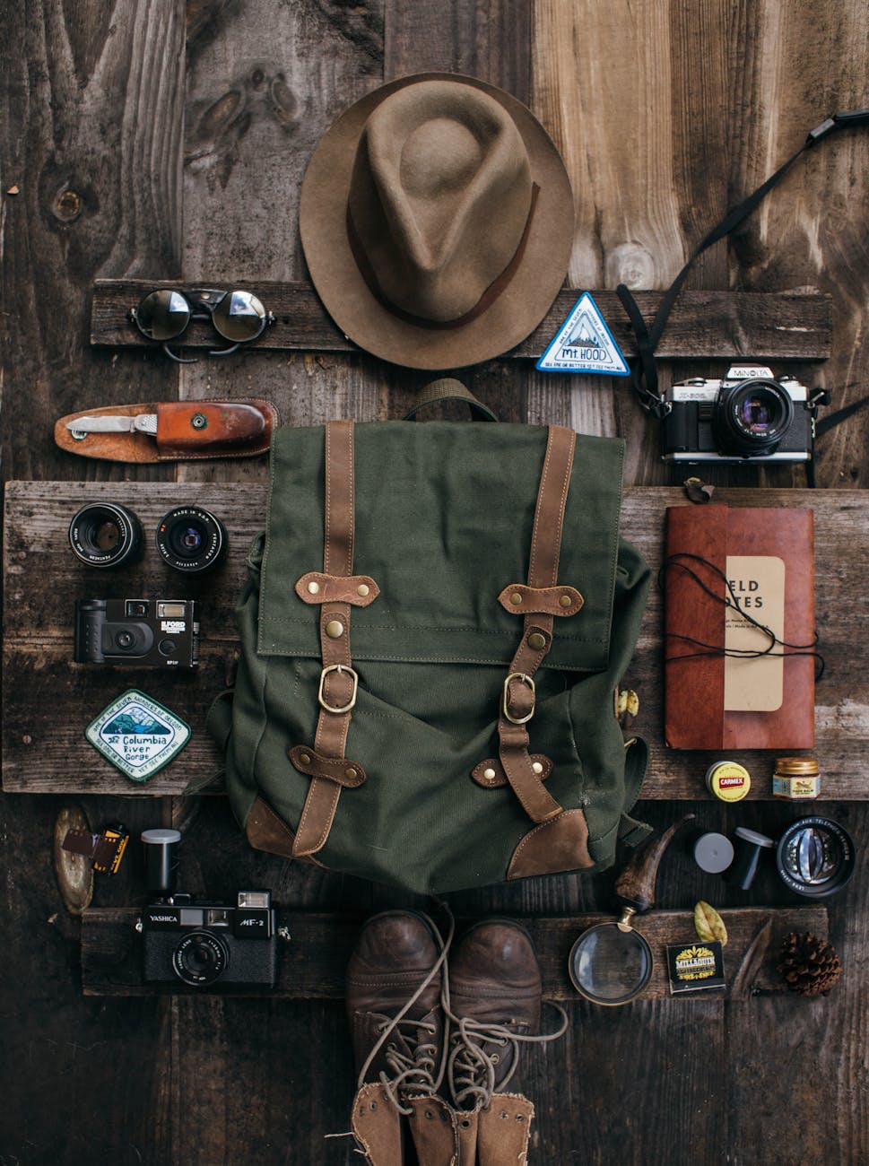 various objects for expedition with retro cameras on desk